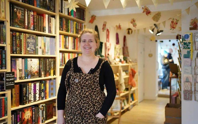 Portrait shot of owner inside book shop