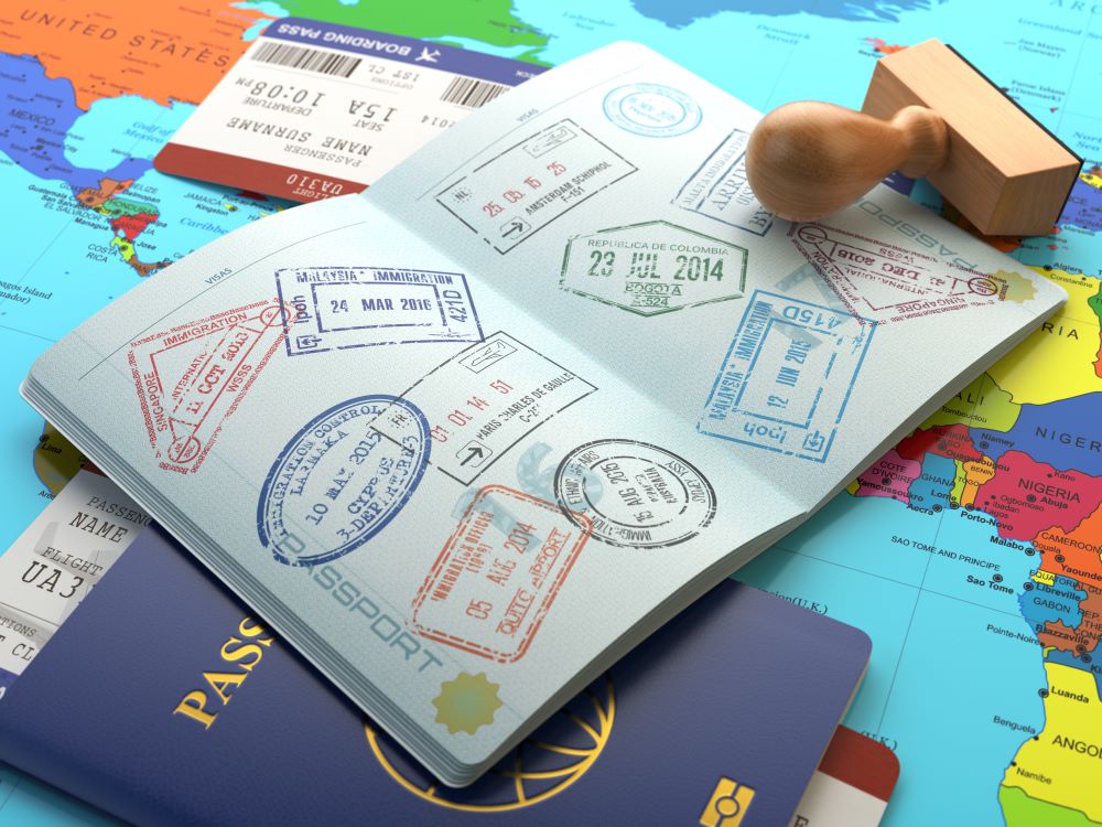 A passport with a page of stamps