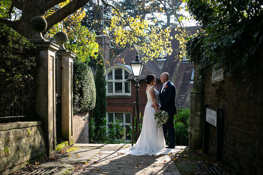 A recently married couple outside One Warwick Park