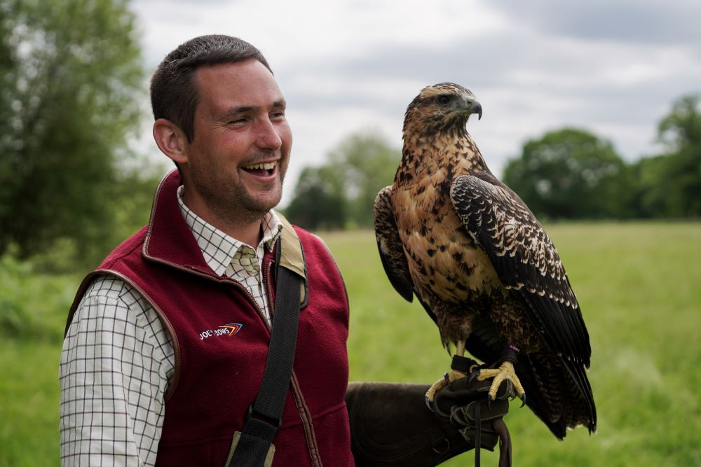 A man holding a falcon