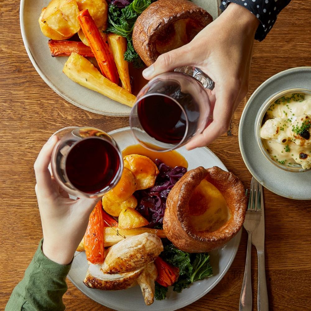 Two people having a roast dinner