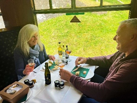 A couple dinning on the heritage train