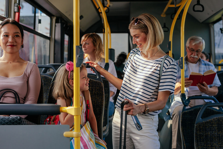 A mother and a daughter on a bus