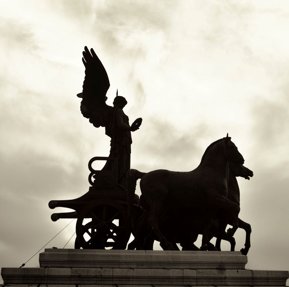 a sculpture of horses pulling a chariot