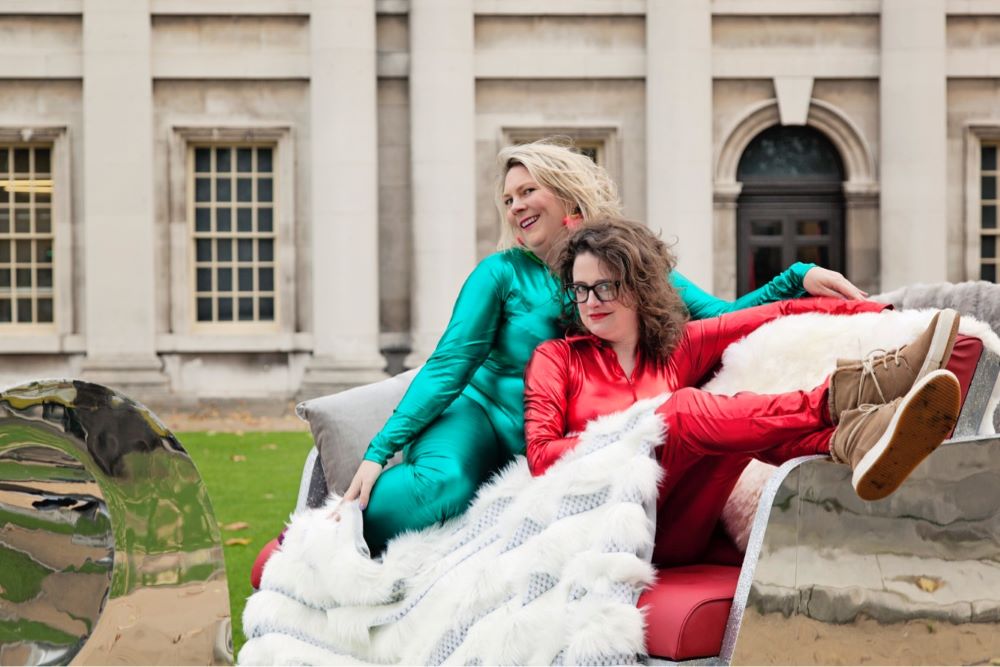 The Scummy Mummies sat on an outdoor sofa