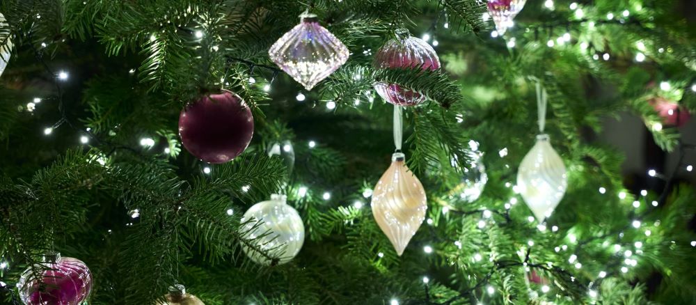 Sparkly Christmas decorations on a Christmas tree at Scotney Castle