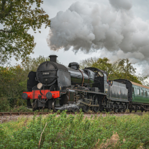 Steam train going through countryside