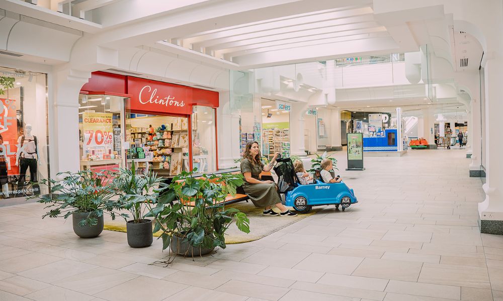 RVP Royal Victoria Place Interior 1000×600 (4) Family on bench seat in shopping centre