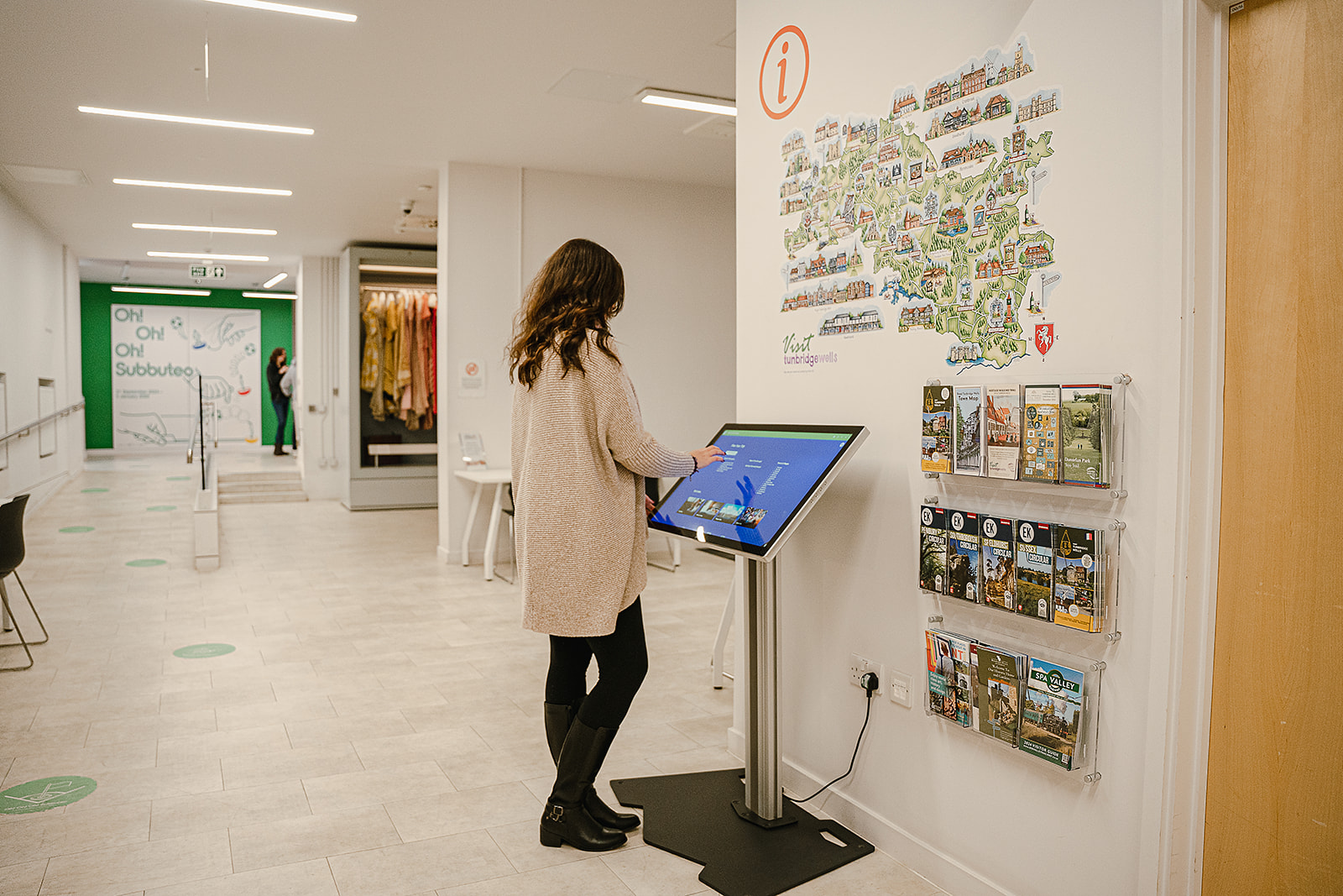 Person using a tourist information touchscreen